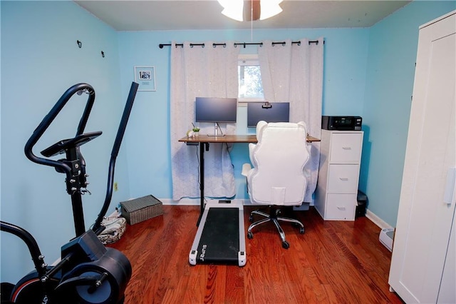 home office with hardwood / wood-style flooring