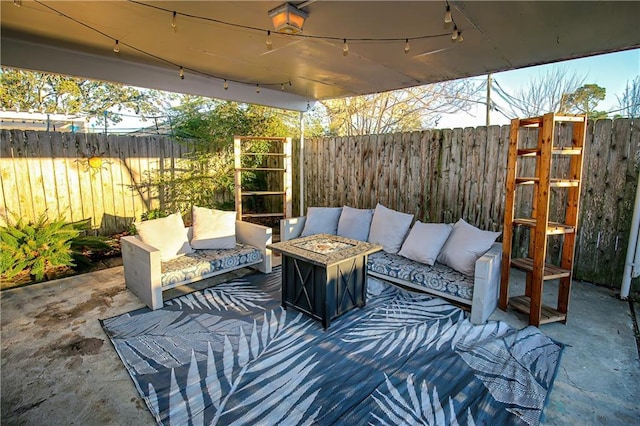 view of patio / terrace with an outdoor living space with a fire pit