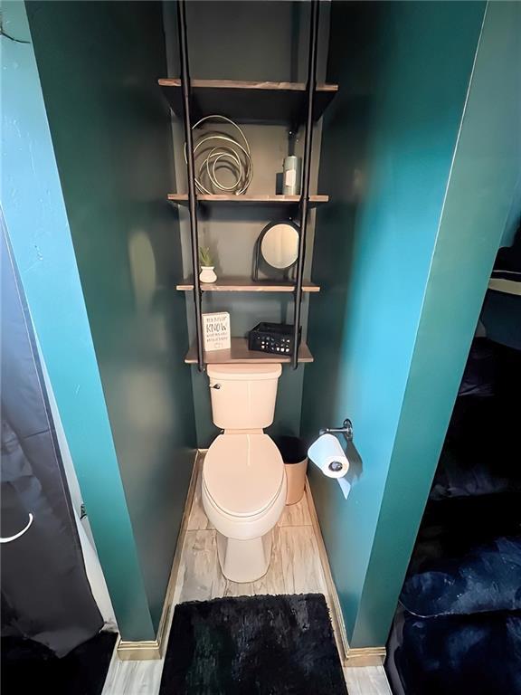 bathroom featuring toilet