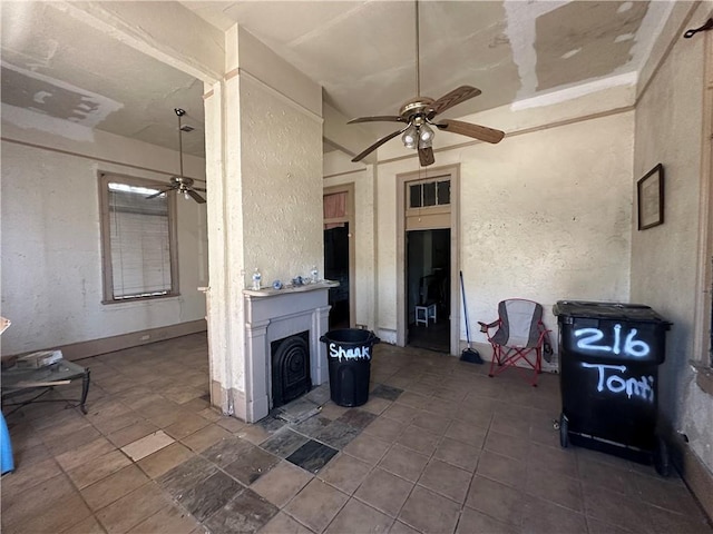 view of patio featuring ceiling fan