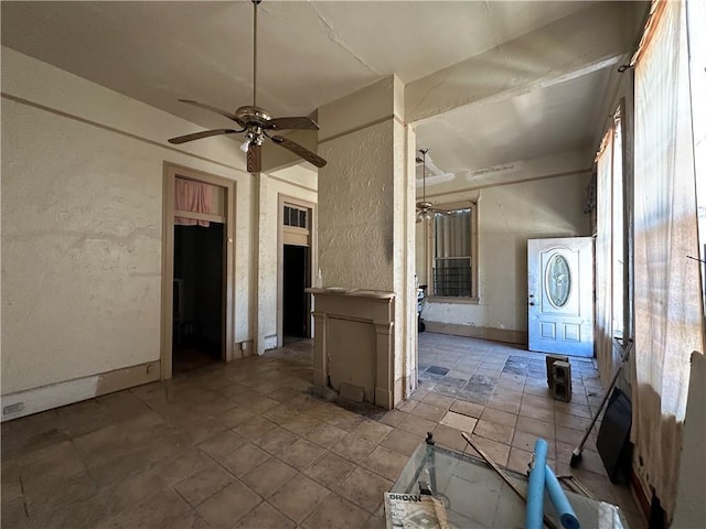 entrance foyer with ceiling fan