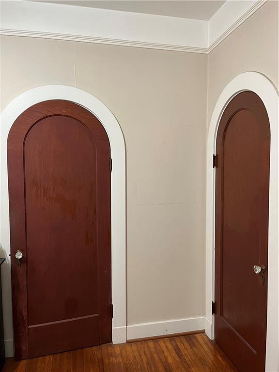 hallway featuring dark hardwood / wood-style floors