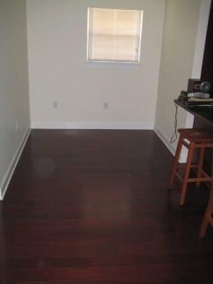 unfurnished room featuring dark wood-type flooring