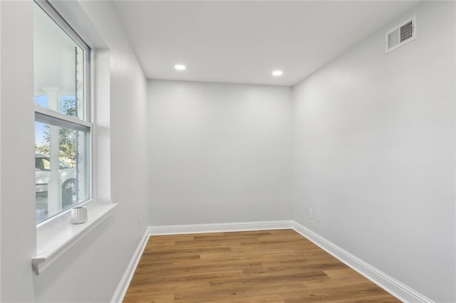 spare room featuring hardwood / wood-style flooring