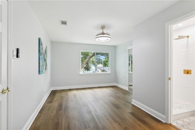 empty room featuring dark wood-type flooring