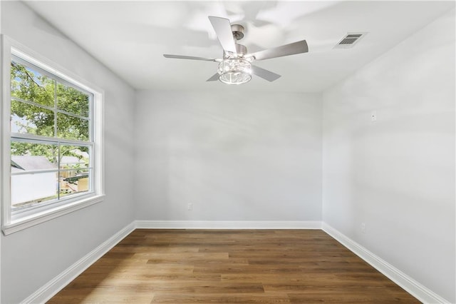 unfurnished room featuring hardwood / wood-style flooring and ceiling fan