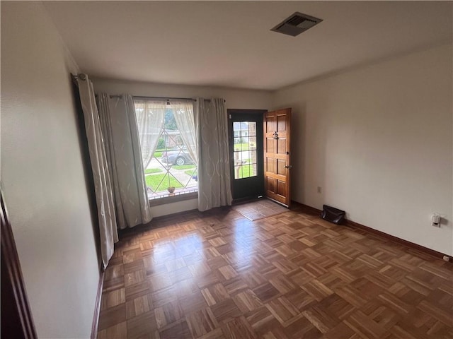 empty room featuring dark parquet floors