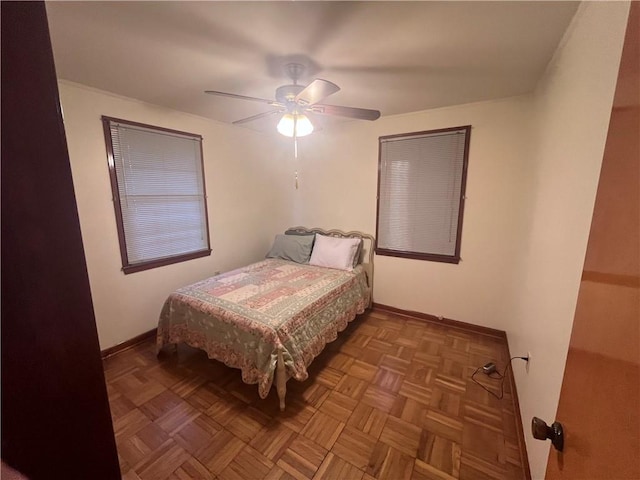 bedroom with parquet flooring and ceiling fan