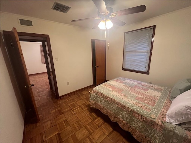 bedroom featuring dark parquet flooring and ceiling fan