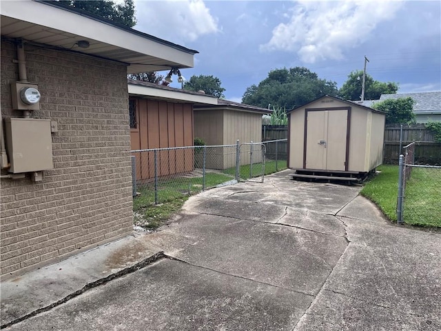 view of patio with a storage shed