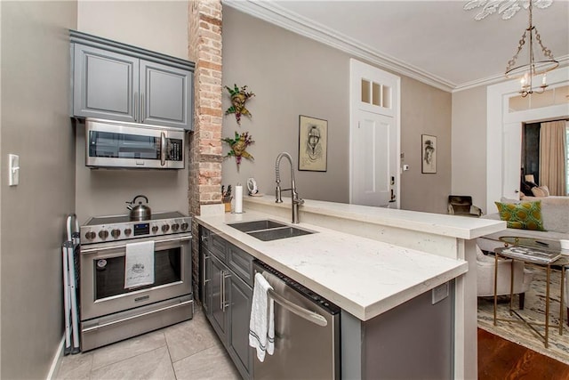 kitchen featuring light tile patterned flooring, appliances with stainless steel finishes, sink, ornamental molding, and kitchen peninsula