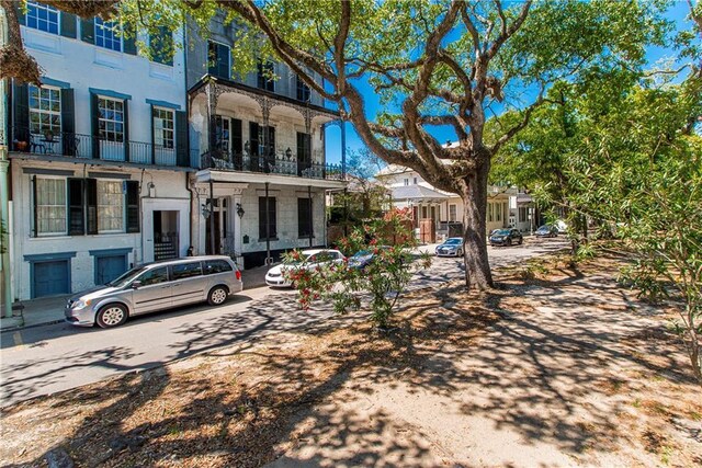 604 Esplanade Ave Unit 101, New Orleans, LA 70116 - view of property featuring stone siding and a residential view