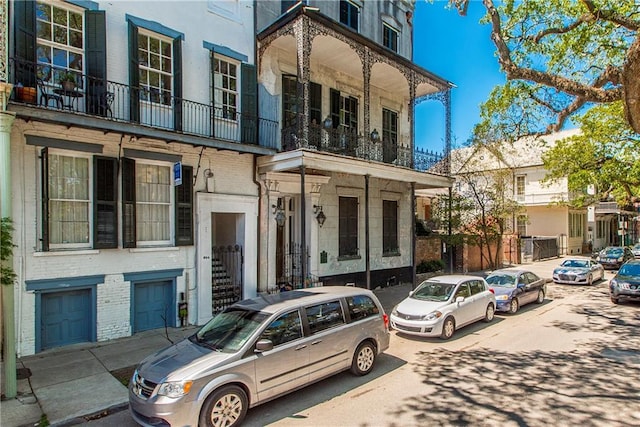 604 Esplanade Ave Unit 101, New Orleans, LA 70116 - townhome / multi-family property featuring brick siding and a balcony