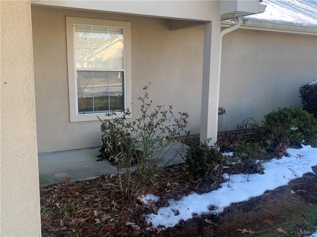 view of snow covered property entrance