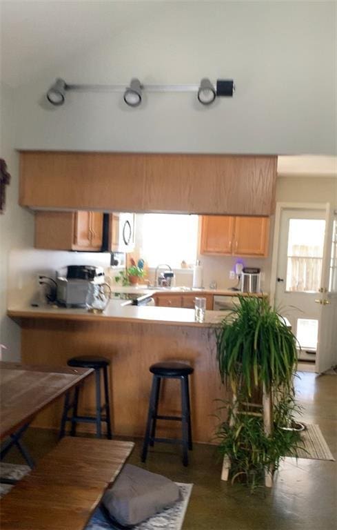 kitchen with a kitchen breakfast bar and kitchen peninsula