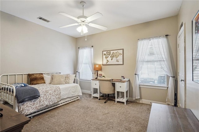 bedroom with ceiling fan and carpet flooring