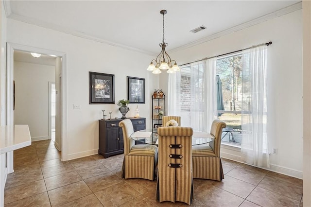 dining space featuring an inviting chandelier, tile patterned floors, and crown molding