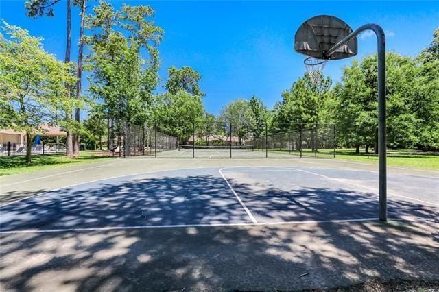 view of sport court featuring tennis court