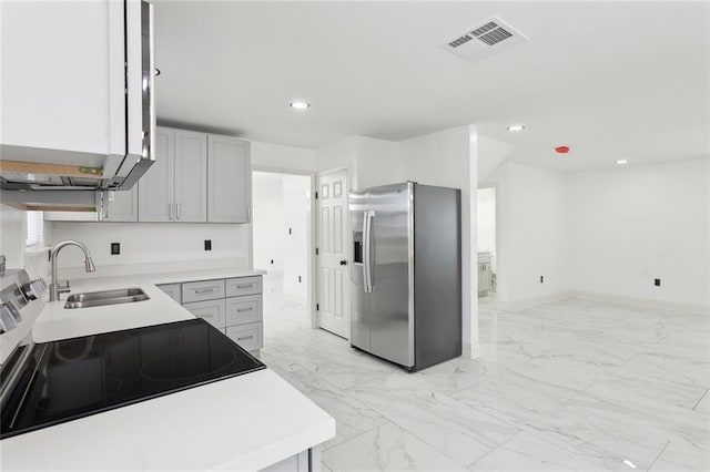 kitchen featuring stainless steel appliances, recessed lighting, marble finish floor, and visible vents