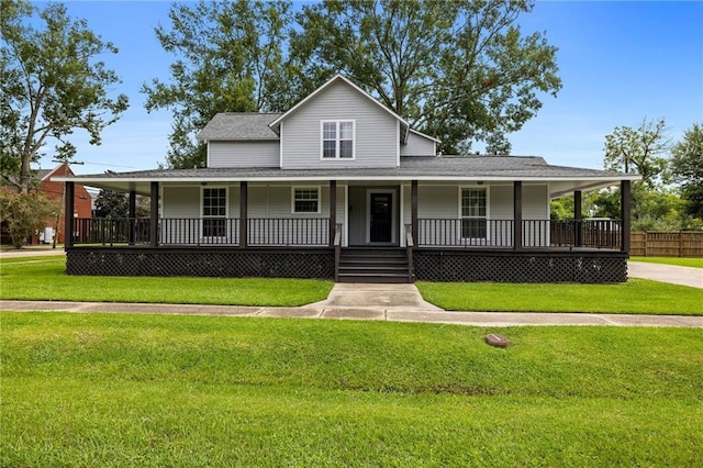 farmhouse-style home featuring a front yard and covered porch