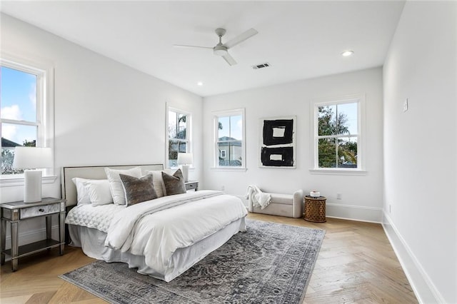 bedroom featuring ceiling fan and light parquet floors