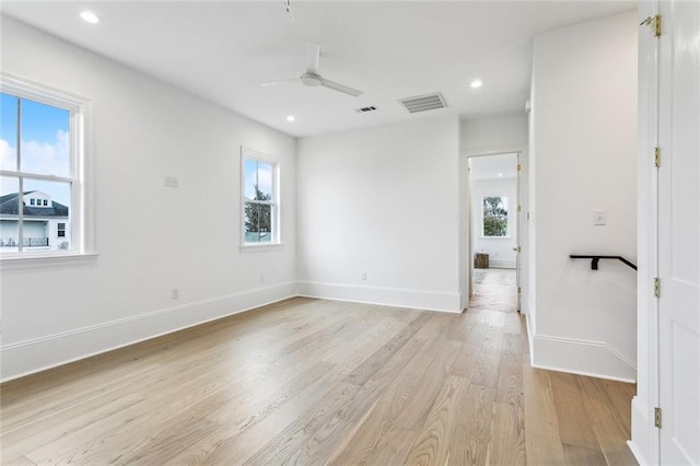 spare room featuring ceiling fan and light hardwood / wood-style floors