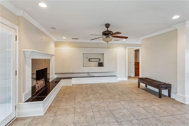 unfurnished living room featuring light tile patterned floors, recessed lighting, ornamental molding, and a fireplace