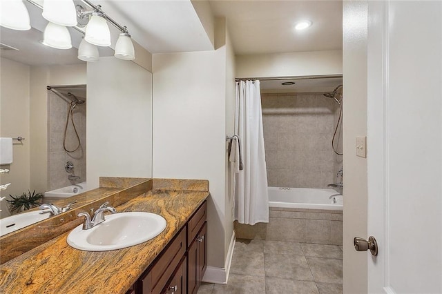 full bathroom with tile patterned floors, vanity, and tiled shower / bath combo