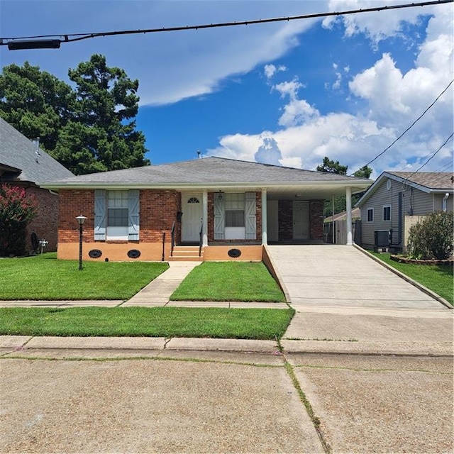 view of front facade with a carport and a front lawn