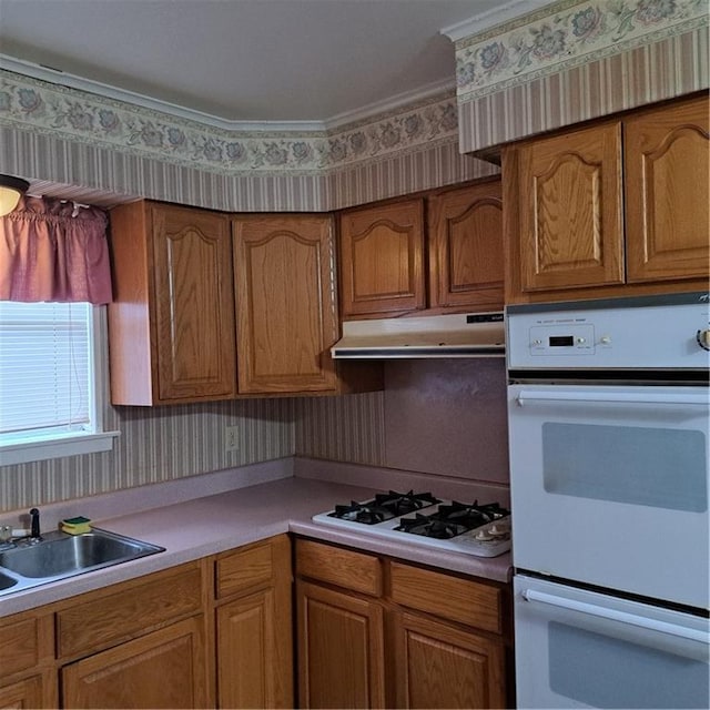 kitchen with sink and white appliances