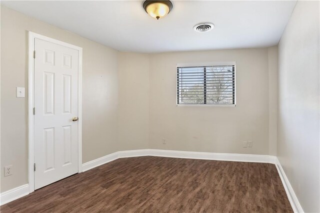 bedroom with dark wood-type flooring