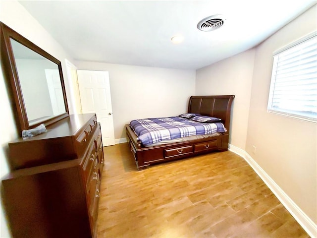 bedroom with light wood-type flooring