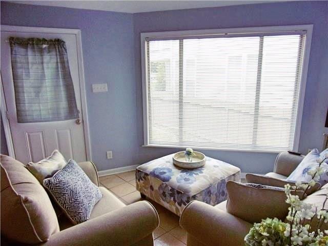 living room with light tile patterned floors