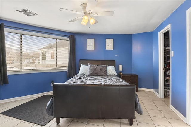 tiled bedroom with ceiling fan