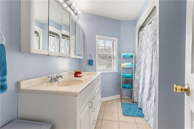 bathroom featuring tile patterned flooring and vanity