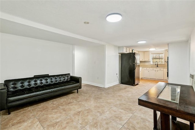 living room featuring baseboards