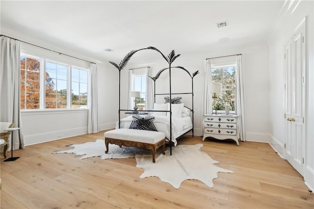 bedroom with light hardwood / wood-style floors