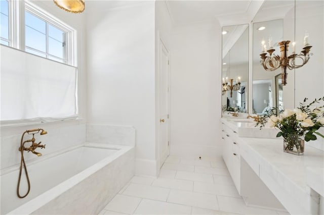 bathroom featuring tiled tub, crown molding, an inviting chandelier, vanity, and tile patterned floors