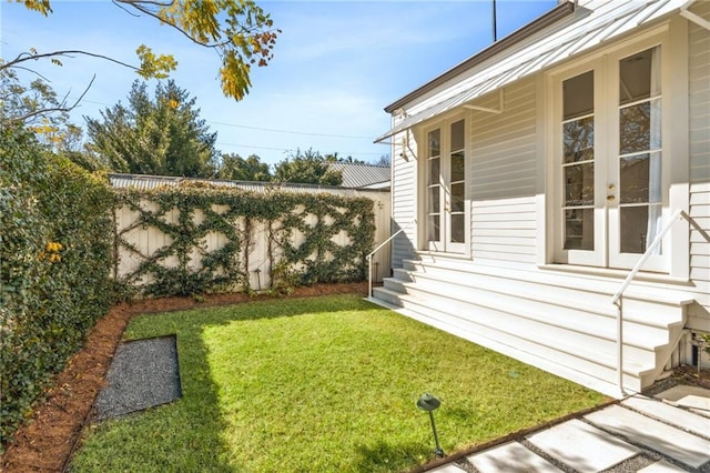 view of yard featuring french doors