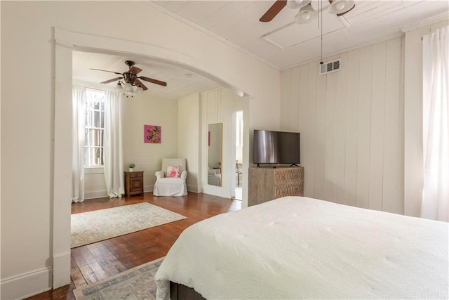 bedroom with dark wood-type flooring and ceiling fan