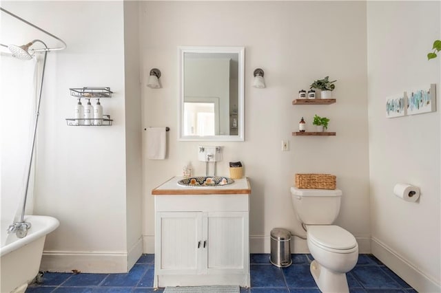 bathroom with vanity, toilet, and a bath