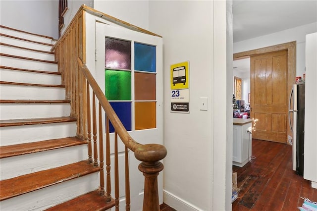 stairs with hardwood / wood-style flooring