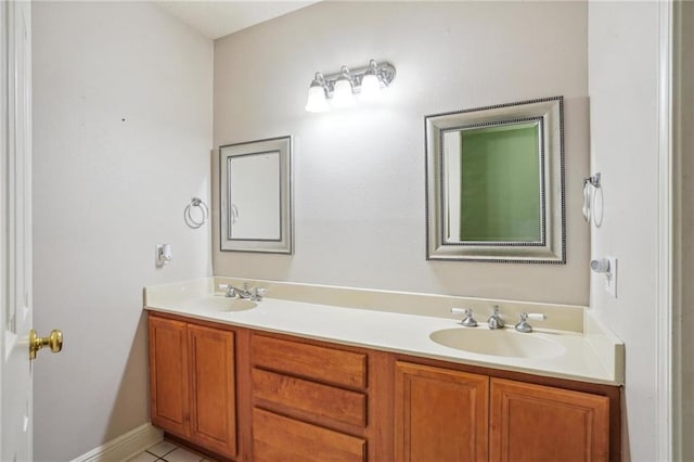 bathroom with tile patterned floors and vanity