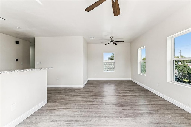 220406 Pauger St, New Orleans, LA 70116 - unfurnished room with a ceiling fan, baseboards, and wood finished floors