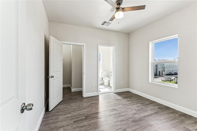 220406 Pauger St, New Orleans, LA 70116 - unfurnished bedroom with wood finished floors, baseboards, and ensuite bathroom