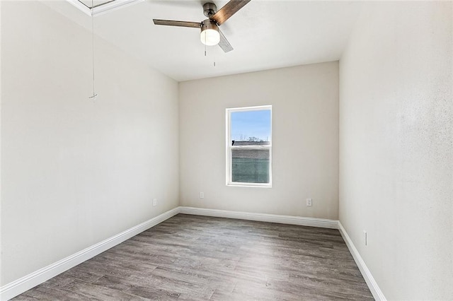 220406 Pauger St, New Orleans, LA 70116 - unfurnished room featuring ceiling fan, wood finished floors, and baseboards