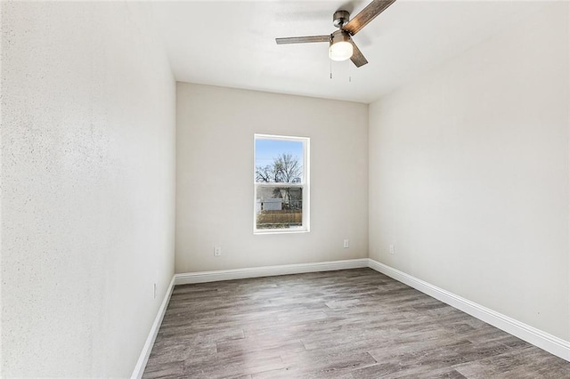 220406 Pauger St, New Orleans, LA 70116 - empty room featuring a ceiling fan, wood finished floors, and baseboards