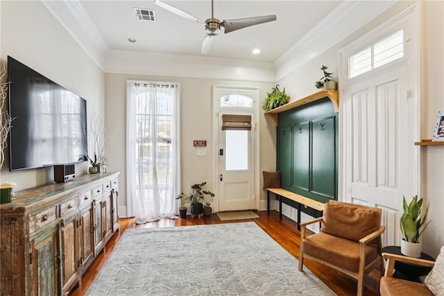 mudroom featuring dark hardwood / wood-style flooring, crown molding, and ceiling fan