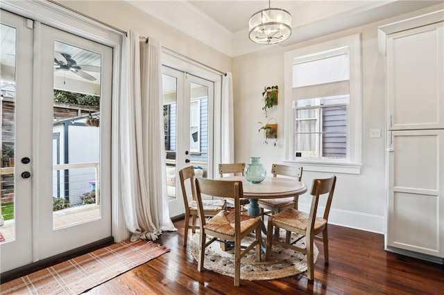 dining space featuring dark hardwood / wood-style floors, a chandelier, french doors, and a healthy amount of sunlight