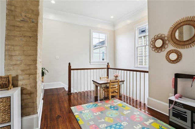 sitting room featuring crown molding and dark hardwood / wood-style flooring